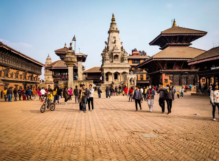 Bhaktapur Durbar Square with traditional Newari architecture and local artisans at work