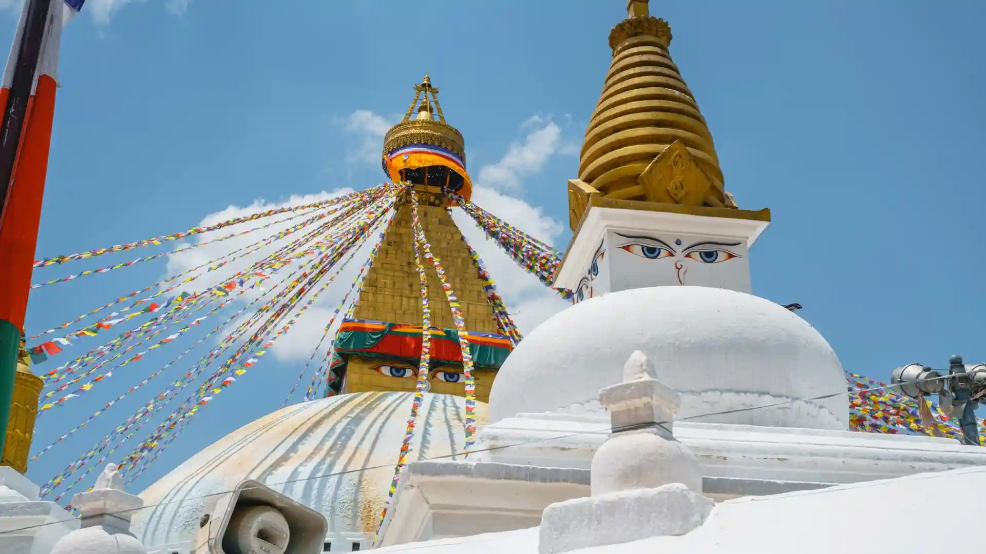 Pilgrims and travelers at the sacred Bouddhanath Stupa at golden hour, Kathmandu