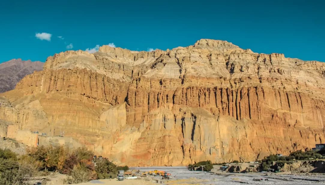 Upper Mustang expedition through ancient Tibetan kingdom with red desert landscapes and Lo Manthang walls