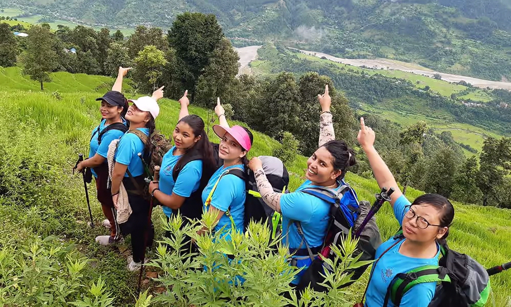 SASANE Sisterhood guides leading travelers along mountain roads in remote villages of Nepal